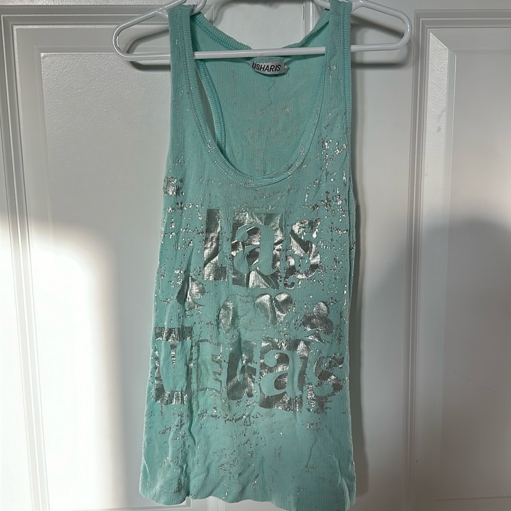 Cute blue top w/ silver letter and design.looks like new.
